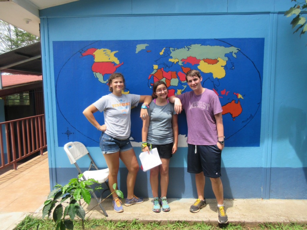 Sarah, Mariah, and Jonah pose with the near-complete World Map.