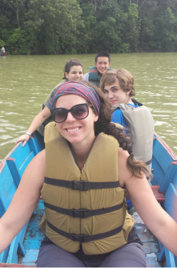 Co-Leader Mary and team aboard a canoe 